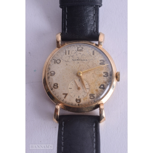 1245 - Garrard 9ct Gold Presentation Watch Hand-Wind Working. 3.5 cm wide.