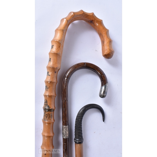 3000 - A bamboo walking cane with a silver collar together with a Japanese cane and another horn handled ca... 