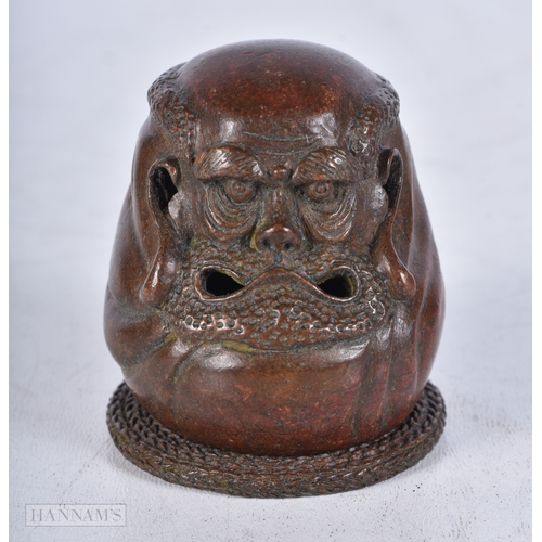 3007 - A Japanese bronze warriors head 5 cm.