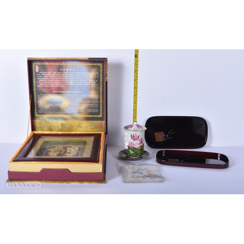 3028 - A boxed framed gold leaf  sculpture of dragons with a 99% golf content together with lacquered dishe... 