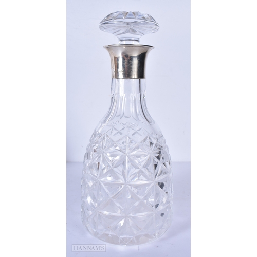 3042 - A pair of silver rimmed cut glass decanters 28cm (2)