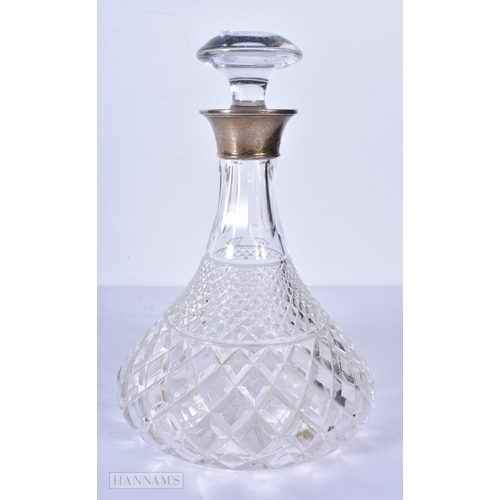 3043 - A silver rimmed cut glass ships decanter 25cm
