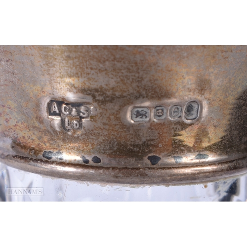 3043 - A silver rimmed cut glass ships decanter 25cm