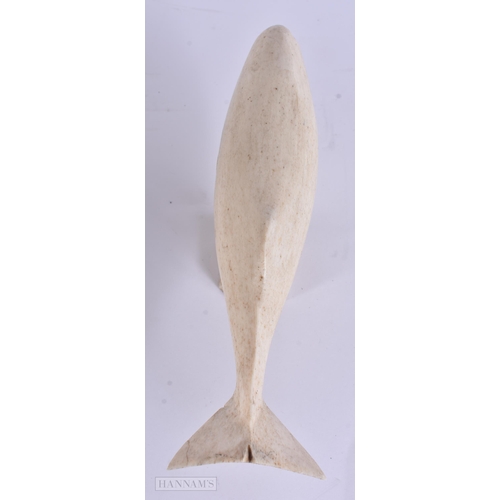 23 - A 19TH CENTURY NORTH AMERICAN TRIBAL INUIT BONE WHALE. 18 cm wide.