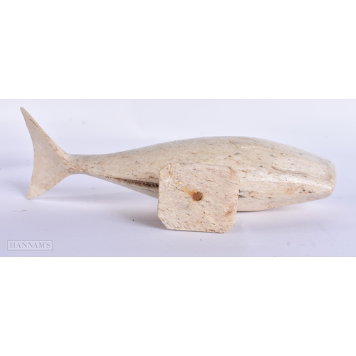 23 - A 19TH CENTURY NORTH AMERICAN TRIBAL INUIT BONE WHALE. 18 cm wide.