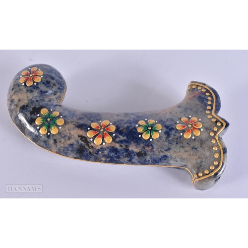 297 - A MIDDLE EASTERN ISLAMIC LACQUERED STONE DAGGER HANDLE. 18 cm long.