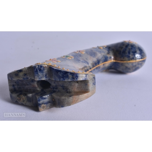 297 - A MIDDLE EASTERN ISLAMIC LACQUERED STONE DAGGER HANDLE. 18 cm long.