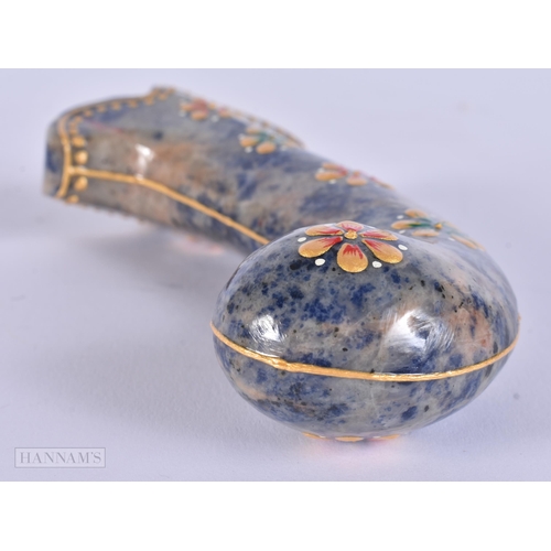 297 - A MIDDLE EASTERN ISLAMIC LACQUERED STONE DAGGER HANDLE. 18 cm long.