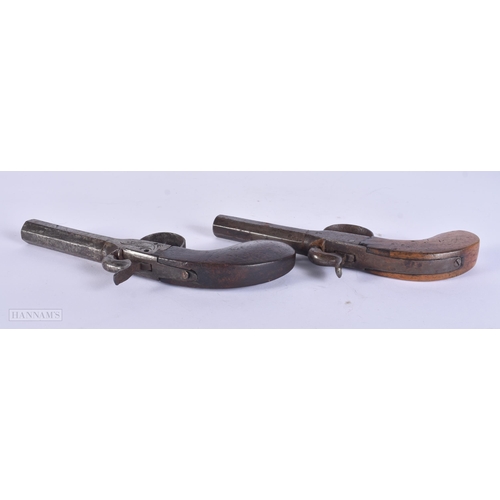 307 - TWO ANTIQUE PISTOLS. 17 cm wide. (2)
