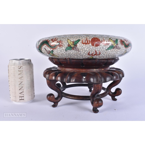 308 - A 19TH CENTURY CHINESE CRACKLE GLAZED PORCELAIN CENSER upon a hardwood base. 24 cm x 17 cm.
