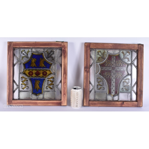 311 - A PAIR OF STAINED GLASS WINDOWS. 35 cm x 38 cm.