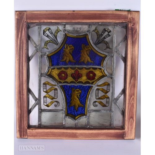 311 - A PAIR OF STAINED GLASS WINDOWS. 35 cm x 38 cm.