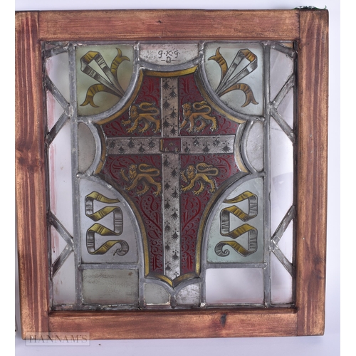 311 - A PAIR OF STAINED GLASS WINDOWS. 35 cm x 38 cm.