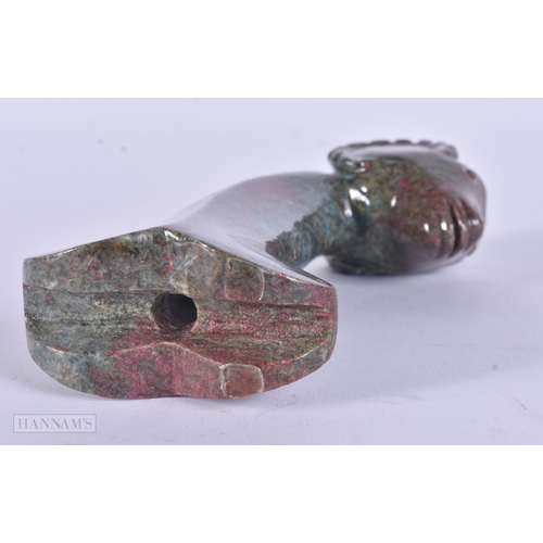 313 - A MIDDLE EASTERN CARVED STONE DAGGER. 472 grams. 14 cm x 8 cm.  WE ARE UNABLE TO SHIP THIS LOT IN-HO... 