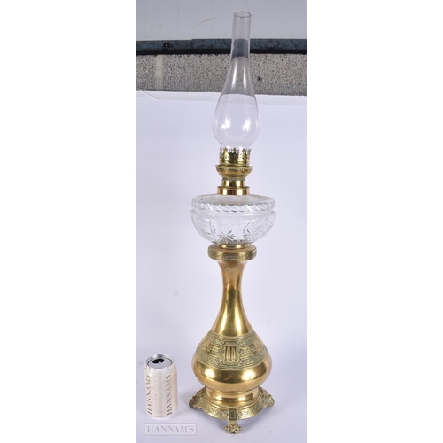 316 - AN ANTIQUE BRASS OIL LAMP. 52 cm high.