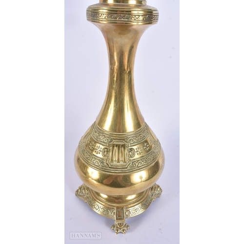 316 - AN ANTIQUE BRASS OIL LAMP. 52 cm high.