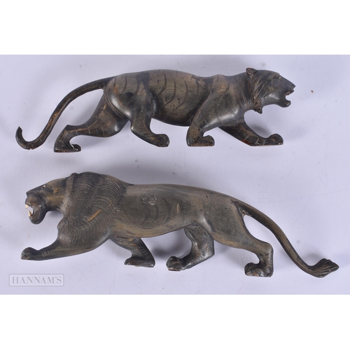 319 - A PAIR OF 19TH CENTURY ANGLO INDIAN CARVED RHINOCEROS HORN BEASTS. 20 cm wide.