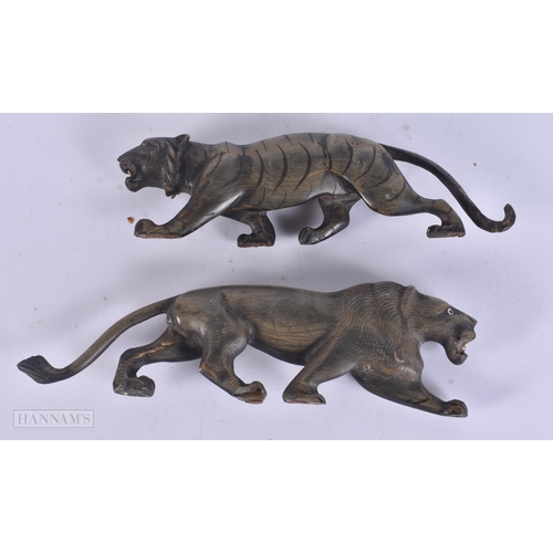 319 - A PAIR OF 19TH CENTURY ANGLO INDIAN CARVED RHINOCEROS HORN BEASTS. 20 cm wide.