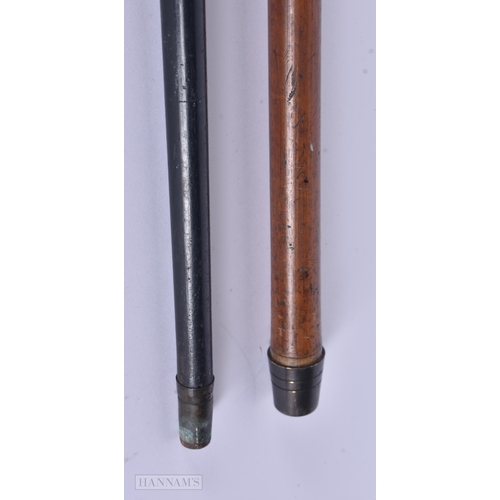 324 - AN ANTIQUE 9CT GOLD MOUNTED WALKING CANE together with a yellow metal cane. 89 cm long. (2)