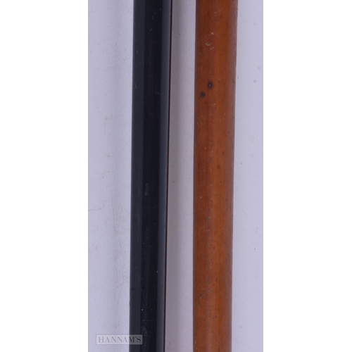324 - AN ANTIQUE 9CT GOLD MOUNTED WALKING CANE together with a yellow metal cane. 89 cm long. (2)
