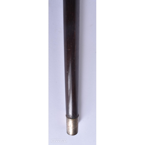 325 - A 19TH CENTURY CARVED RHINOCEROS HORN HORSE HOOF WALKING CANE. 88 cm long.