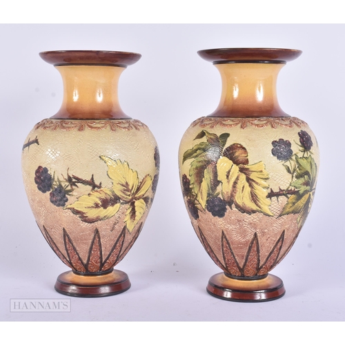 333 - A PAIR OF DOULTON STONEWARE VASES. 22 cm high.