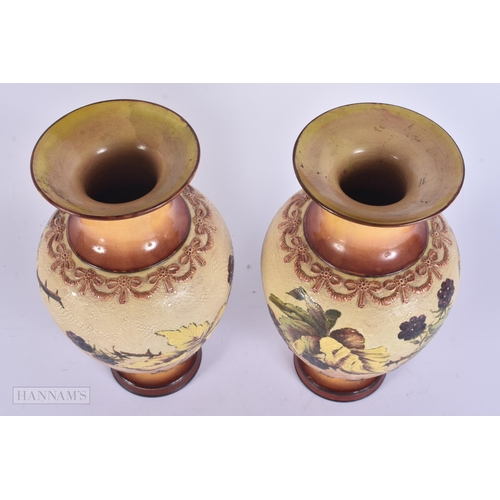 333 - A PAIR OF DOULTON STONEWARE VASES. 22 cm high.
