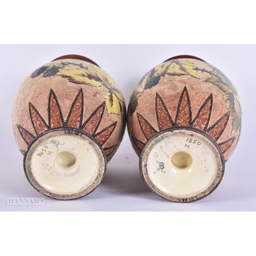 333 - A PAIR OF DOULTON STONEWARE VASES. 22 cm high.