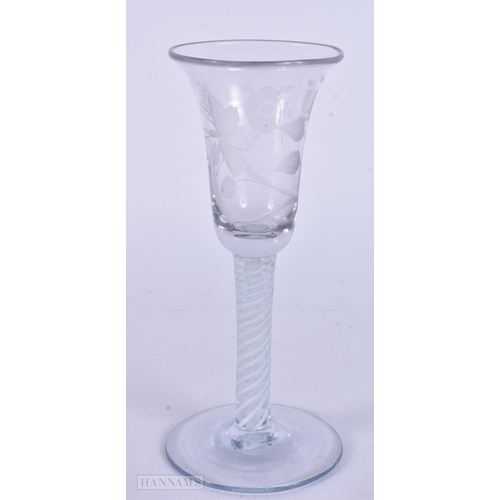 338 - AN ANTIQUE ENGRAVED GLASS. 17 cm high.