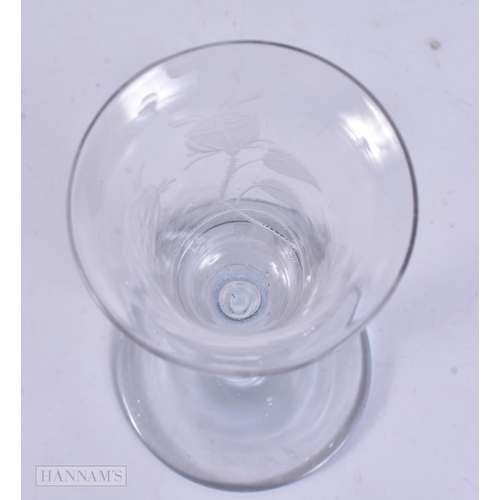 338 - AN ANTIQUE ENGRAVED GLASS. 17 cm high.