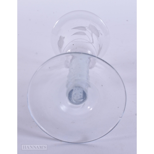 338 - AN ANTIQUE ENGRAVED GLASS. 17 cm high.