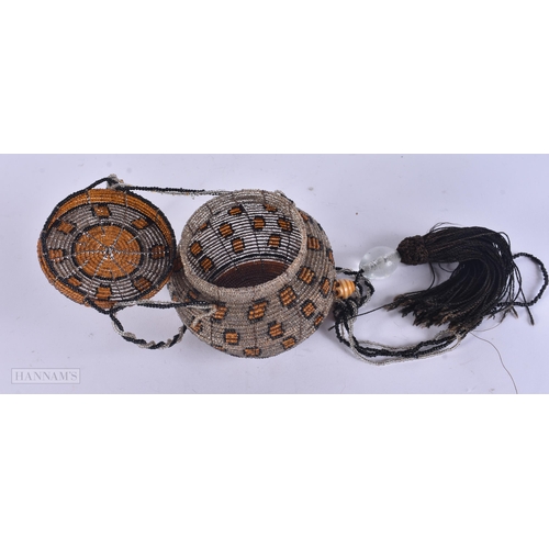 339 - AN UNUSUAL GLASS BEAD HANGING LANTERN. 59 cm long.