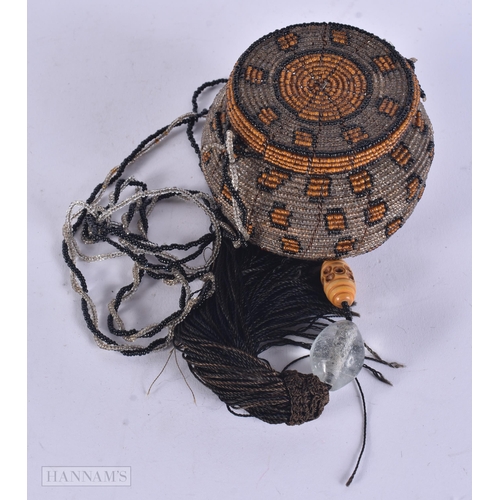 339 - AN UNUSUAL GLASS BEAD HANGING LANTERN. 59 cm long.