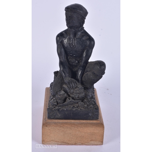 341 - AN UNUSUAL COAL FIGURE OF A WORKER. 20 cm high.