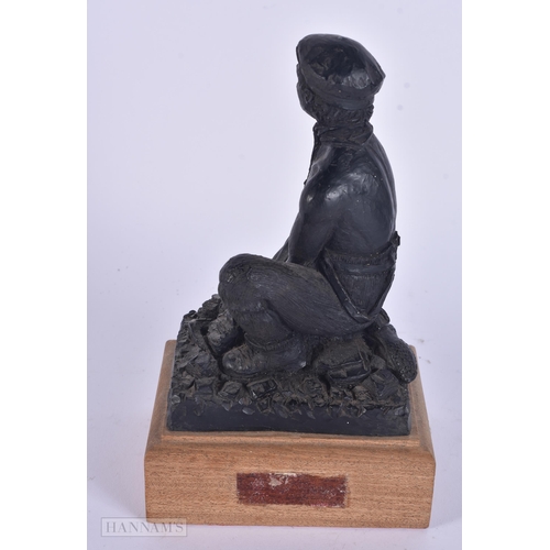 341 - AN UNUSUAL COAL FIGURE OF A WORKER. 20 cm high.