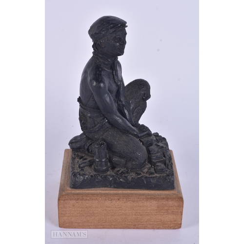 341 - AN UNUSUAL COAL FIGURE OF A WORKER. 20 cm high.