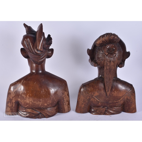 343 - A PAIR OF SOUTHEAST ASIAN WOODEN BUSTS. 30 cm x 15 cm.