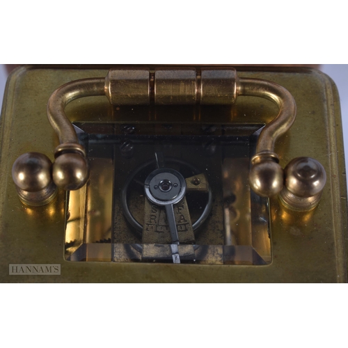 346 - AN ANTIQUE MINIATURE BRASS CARRIAGE CLOCK. 11 cm high inc handle.