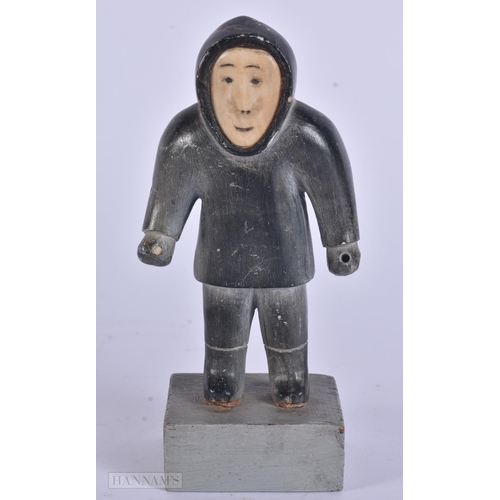 353 - AN EARLY 20TH CENTURY NORTH AMERICAN INUIT CARVED STONE FIGURE modelled as a hunter. 13 cm high.