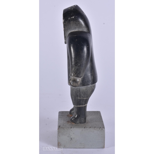 353 - AN EARLY 20TH CENTURY NORTH AMERICAN INUIT CARVED STONE FIGURE modelled as a hunter. 13 cm high.