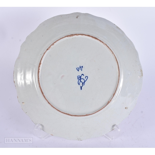 355 - AN UNUSUAL ANTIQUE FRENCH FAIENCE DRAGON PLATE. 23.5 cm wide.