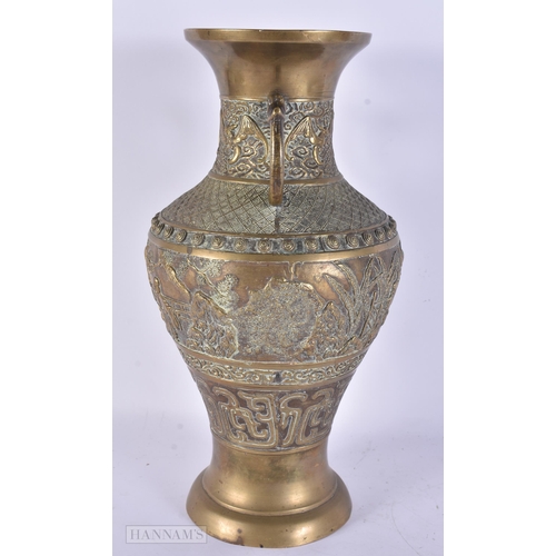 419 - A LARGE 19TH CENTURY CHINESE TWIN HANDLED BRONZE VASE Qing, decorated with figures in landscapes. 36... 