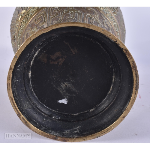 419 - A LARGE 19TH CENTURY CHINESE TWIN HANDLED BRONZE VASE Qing, decorated with figures in landscapes. 36... 