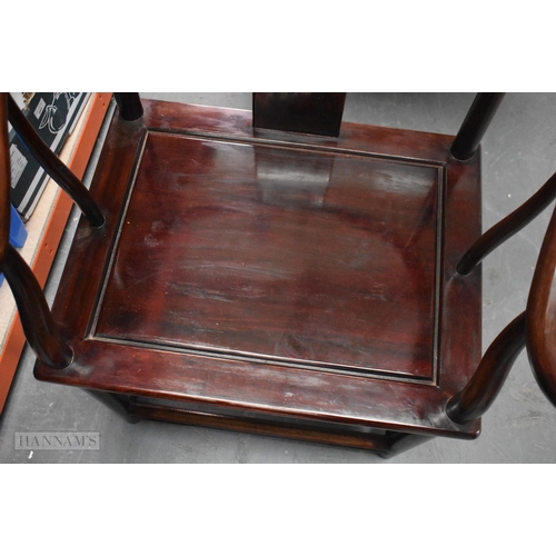 423 - A PAIR OF CHINESE QING DYNASTY CARVED HARDWOOD ARM CHAIRS. 90cm x 60cm.
