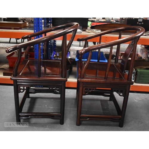 423 - A PAIR OF CHINESE QING DYNASTY CARVED HARDWOOD ARM CHAIRS. 90cm x 60cm.