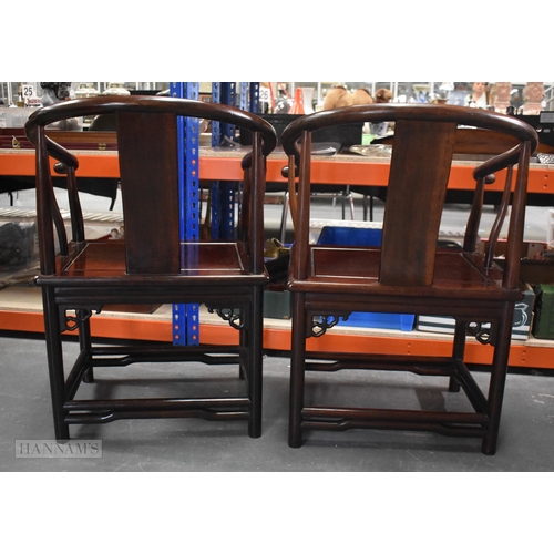 423 - A PAIR OF CHINESE QING DYNASTY CARVED HARDWOOD ARM CHAIRS. 90cm x 60cm.