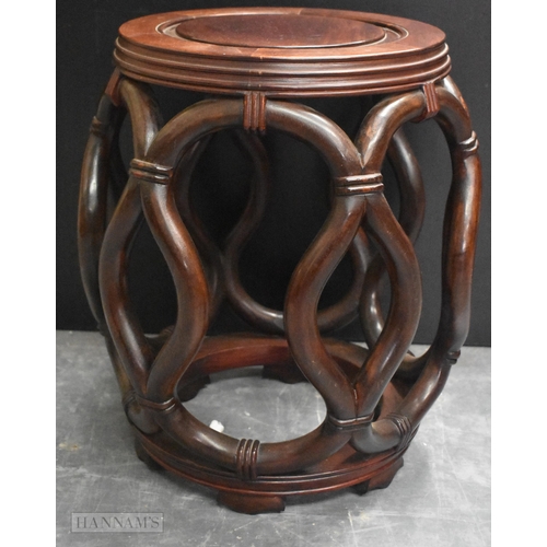 424 - A LATE 19TH/20TH CENTURY CHINESE CARVED HARDWOOD BARREL SET Late Qing. 45 cm x 30 cm.