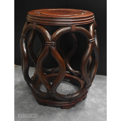 424 - A LATE 19TH/20TH CENTURY CHINESE CARVED HARDWOOD BARREL SET Late Qing. 45 cm x 30 cm.
