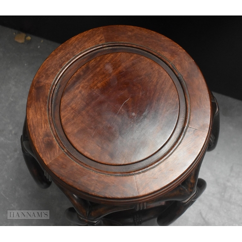 424 - A LATE 19TH/20TH CENTURY CHINESE CARVED HARDWOOD BARREL SET Late Qing. 45 cm x 30 cm.