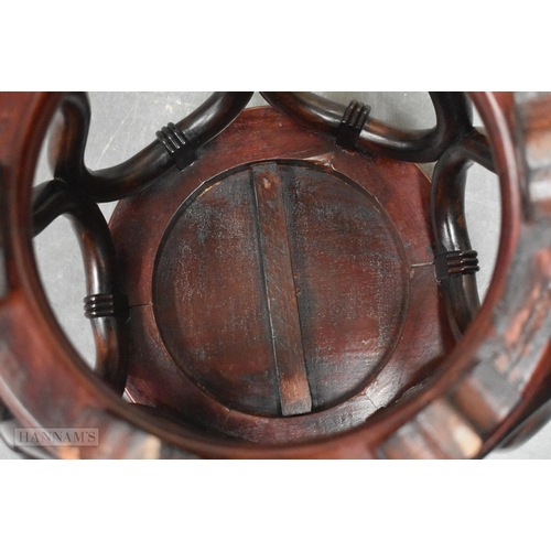 424 - A LATE 19TH/20TH CENTURY CHINESE CARVED HARDWOOD BARREL SET Late Qing. 45 cm x 30 cm.